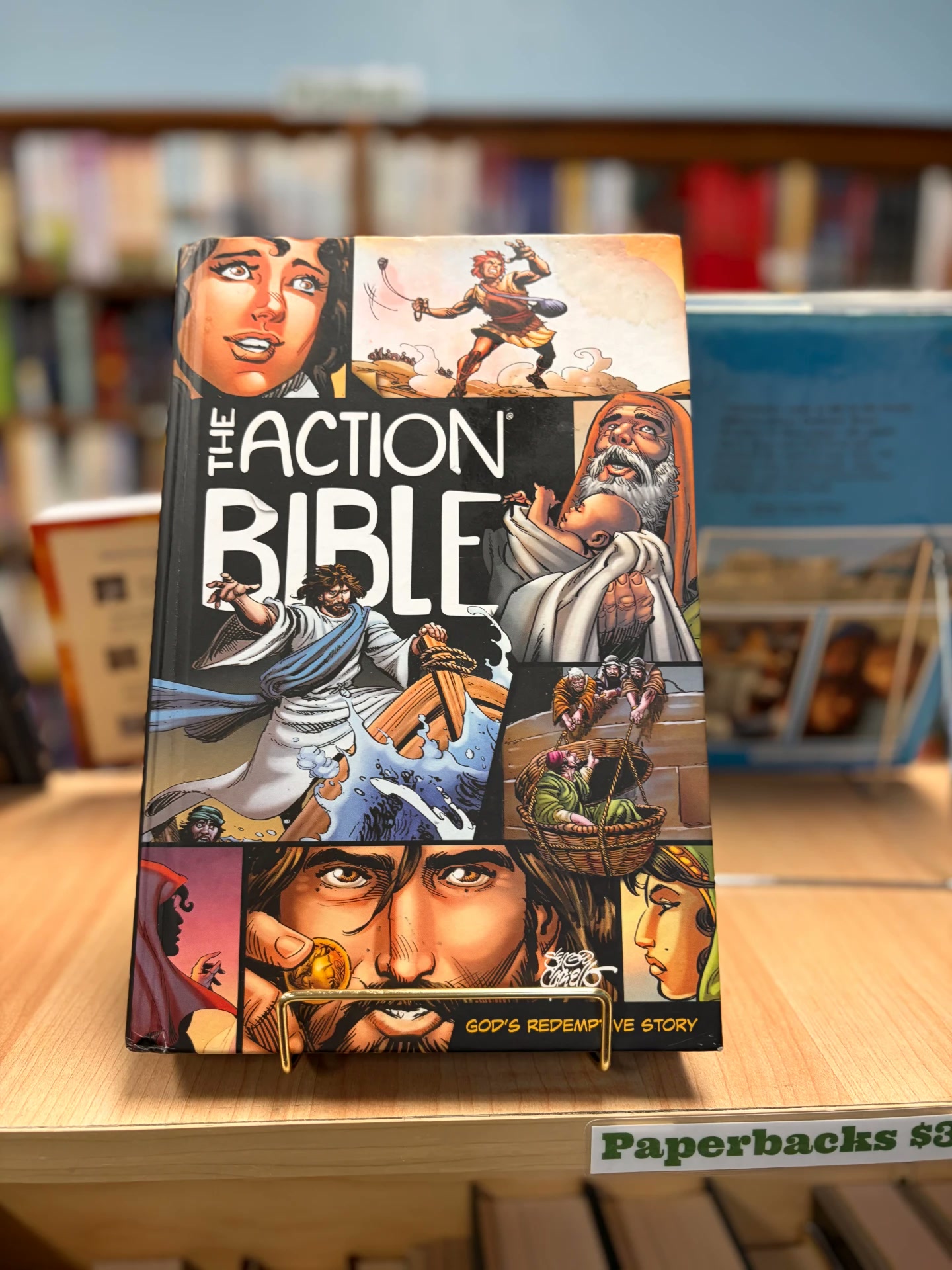The Action Bible displayed on a shelf