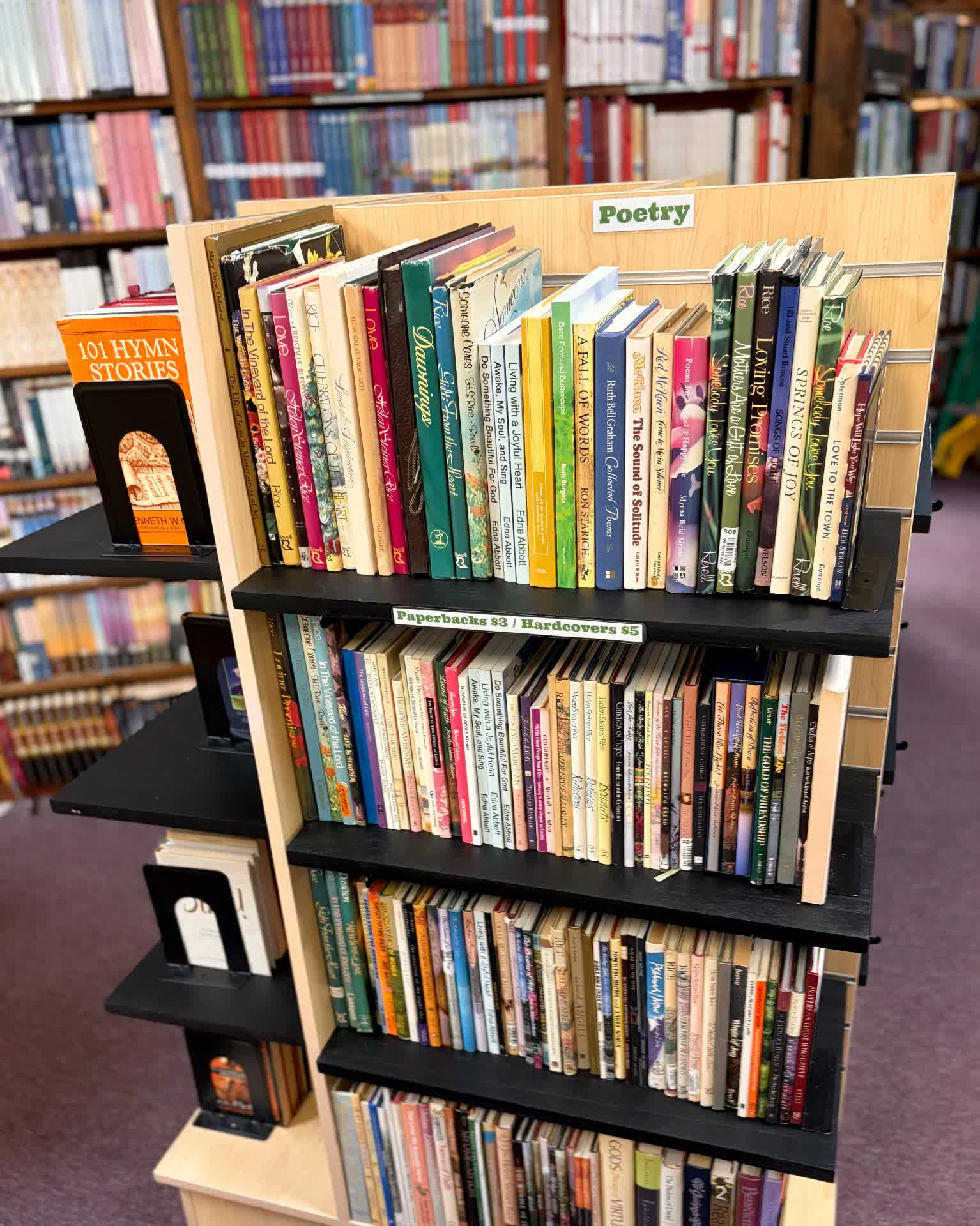 Poetry shelf with used poetry and devotional titles