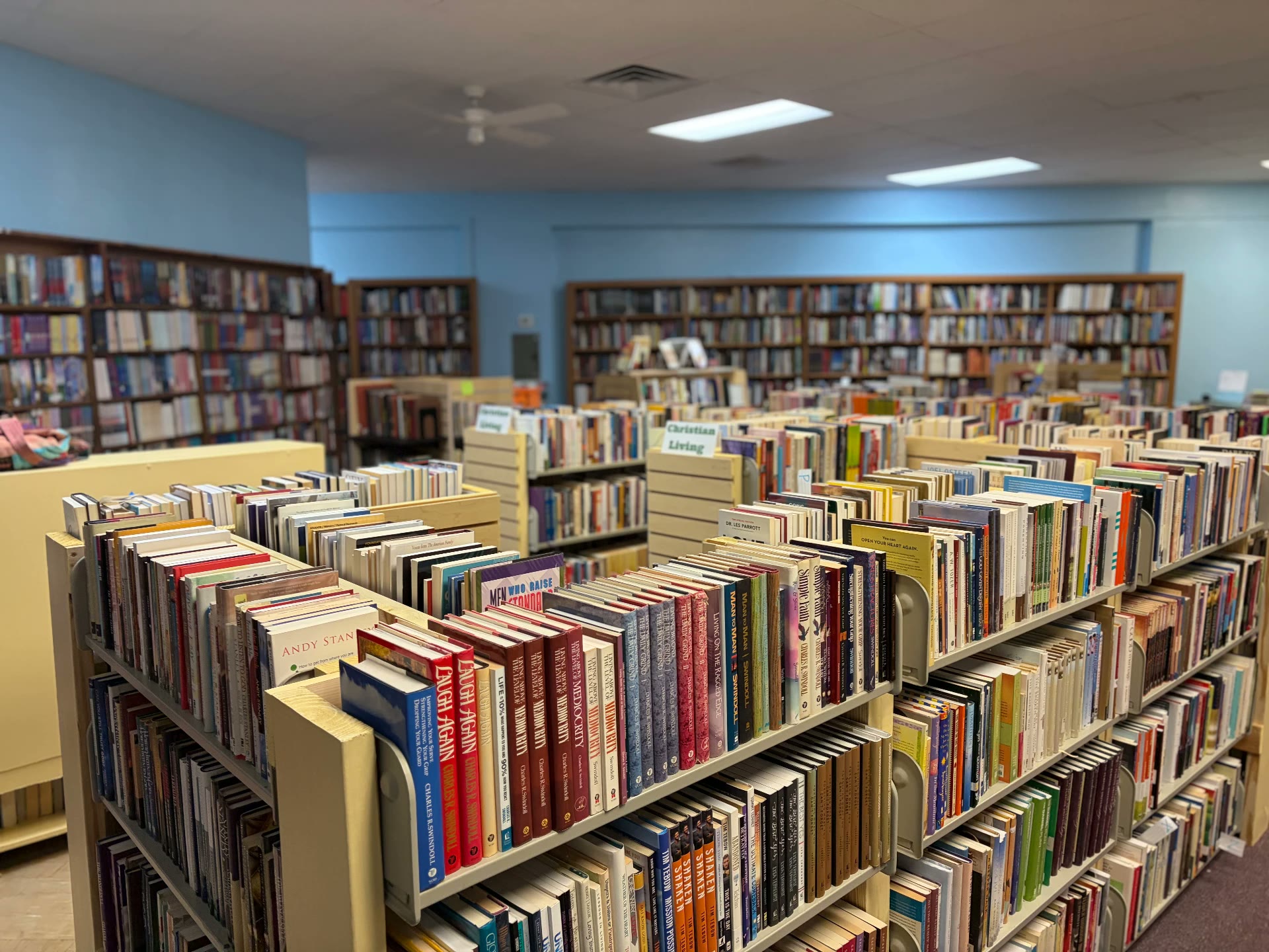 Christian Living aisle with rows of gently used books