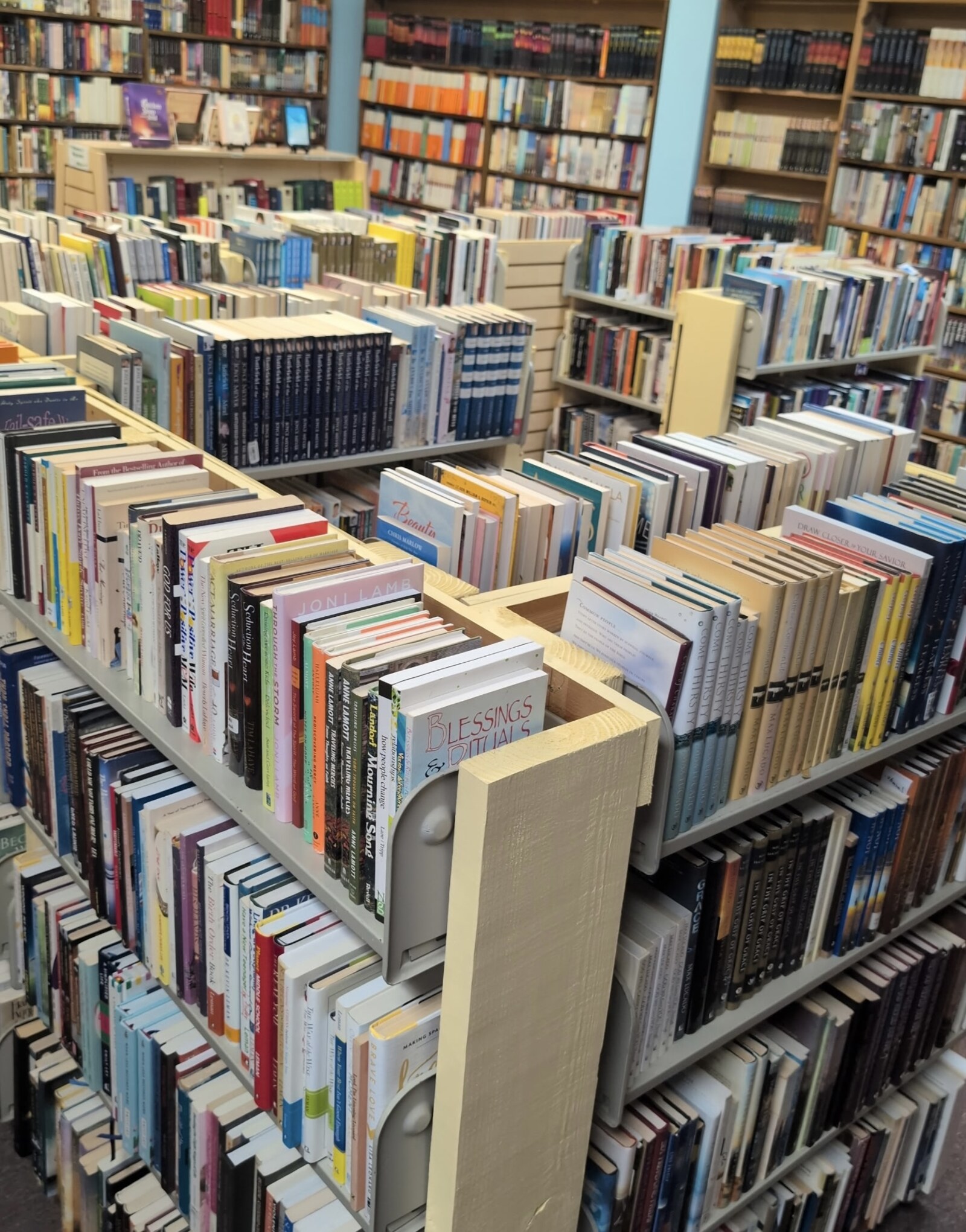 Aisles of gently used Christian books on the shelves
